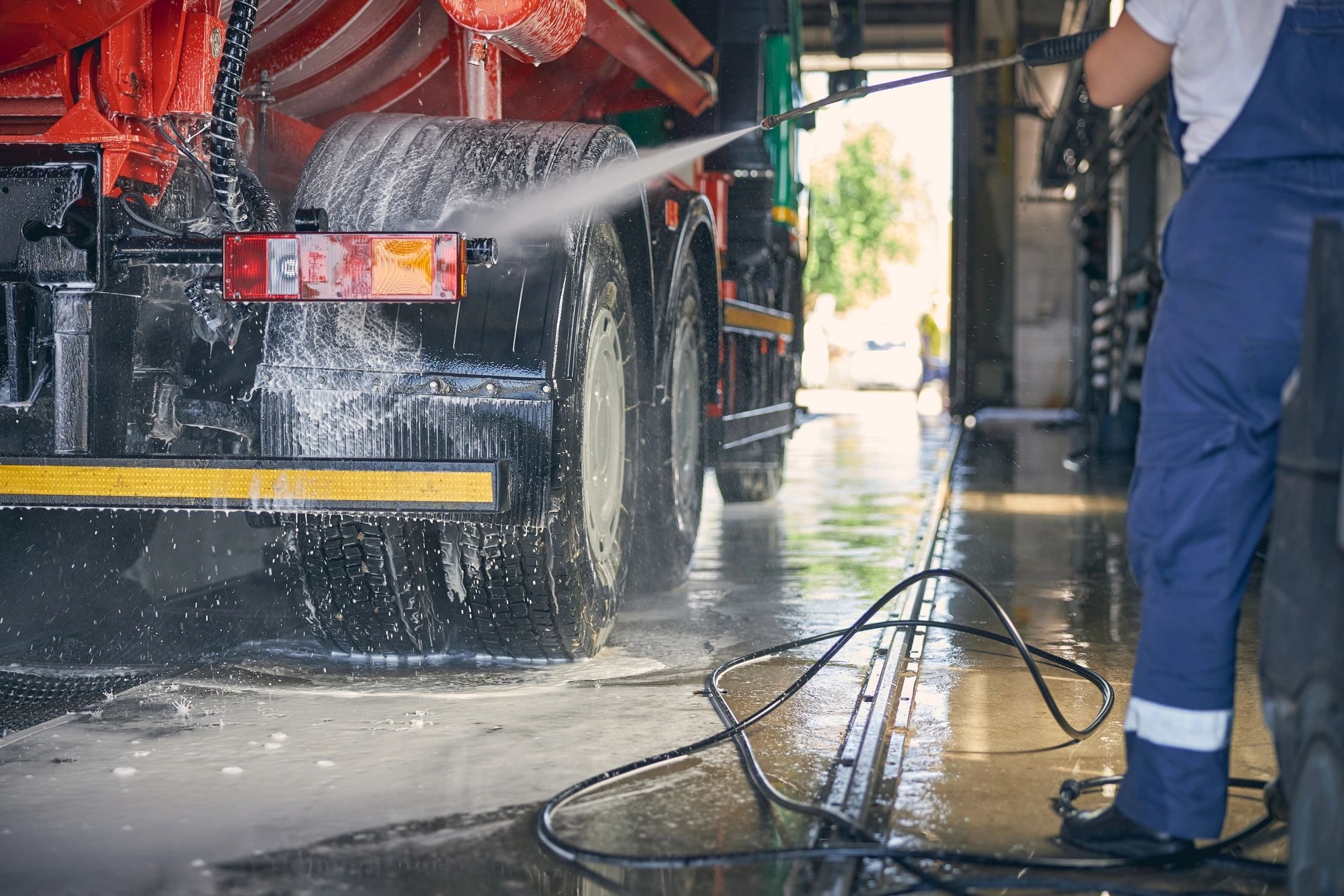 Commercial truck being washed at professional facility